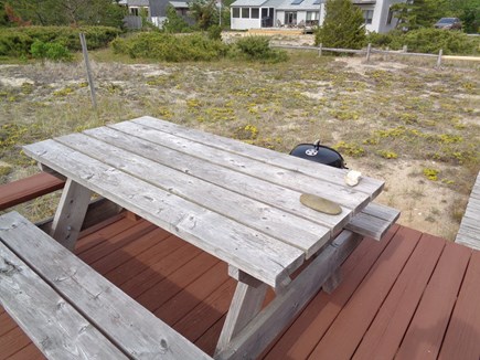 Wellfleet Cape Cod vacation rental - Picnic table on outdoor deck for al fresco dining.