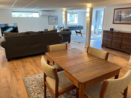 Harwich Cape Cod vacation rental - Daylight basement with 2 sofas, card table and foosball