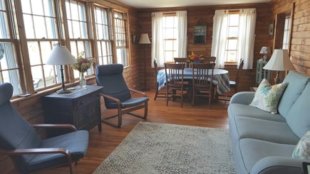 Sagamore Beach Cape Cod vacation rental - Living room with wall of windows facing the water.