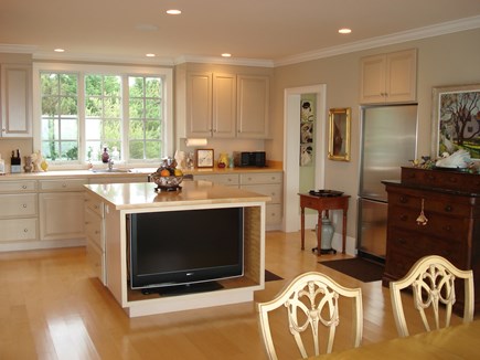 North Truro Cape Cod vacation rental - View from dining area to kitchen and pantry.  Sony TV in island.