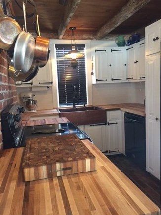 Harwich Cape Cod vacation rental - Updated kitchen with subway tiles and butcher block counters.