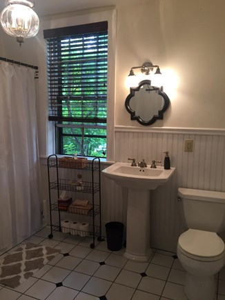 Harwich Cape Cod vacation rental - First floor master bathroom with access from living room.