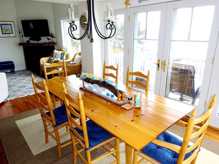 East Orleans Cape Cod vacation rental - Dining area with doors to back deck .