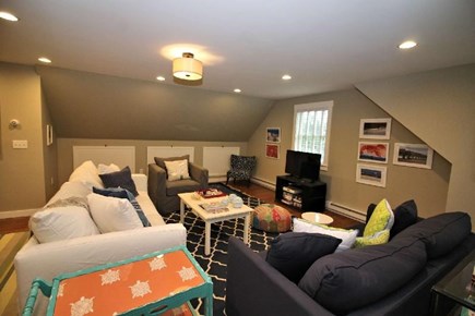 Truro Cape Cod vacation rental - Second level family room with large TV, couch opens to queen bed