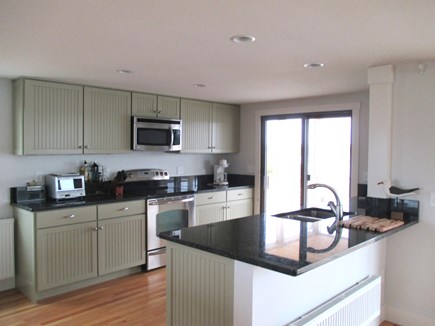 Truro Cape Cod vacation rental - Partial view of kitchen, door to deck