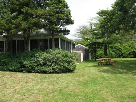 Orleans Cape Cod vacation rental - Front and side of cottage w/ picnic table,outdoor shower & shed