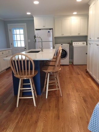 Falmouth Cape Cod vacation rental - Kitchen Washer and Dryer in the Kitchen, door to large backyard