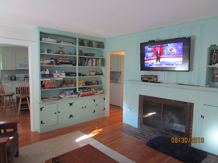 Falmouth Cape Cod vacation rental - Living room: cupboards with games/puzzles