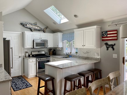 South Chatham Cape Cod vacation rental - Large and updated eat in kitchen with breakfast bar.