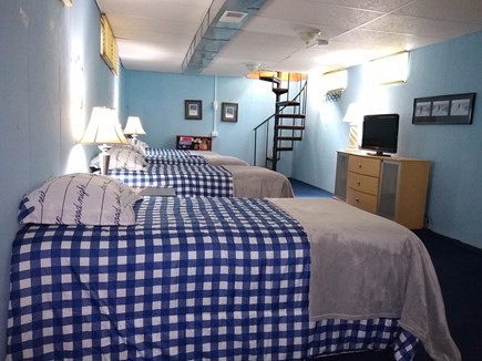 Dennisport Cape Cod vacation rental - Bottom floor bedroom has 4 twin beds with a full bath.