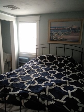 Dennisport Cape Cod vacation rental - Master bedroom with half bath.