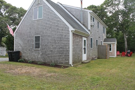South Chatham Cape Cod vacation rental - View of the backyard with outdoor shower and sitting area