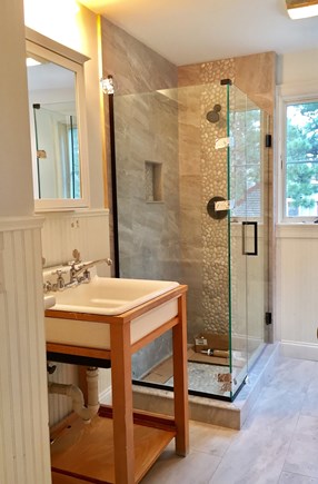 Eastham Cape Cod vacation rental - Remodel front bathroom with beach pebble glass enclosed shower.