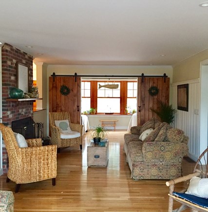 Eastham Cape Cod vacation rental - Open living room with barn doors leading into 3rd sleeping area.