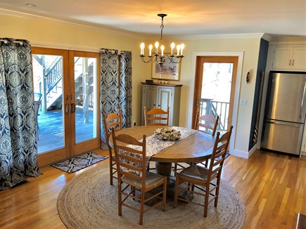 Eastham Cape Cod vacation rental - View of the dining area with large slider to expansive deck.