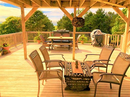 Eastham Cape Cod vacation rental - Beautiful expansive lower deck with dining set and extra seating.