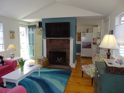 Hyannis Cape Cod vacation rental - Living room with TV, door to back yard