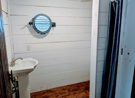 Falmouth Cape Cod vacation rental - Bathroom with view of Falmouth Harbor through port hole.