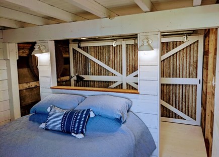 Falmouth Cape Cod vacation rental - Bedroom with barn door closet area.