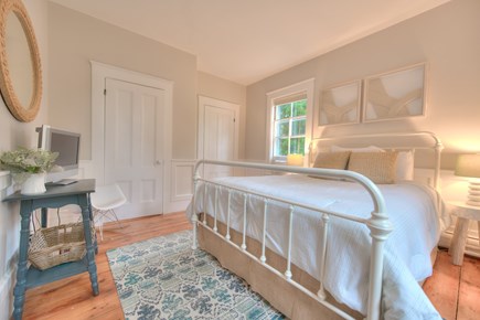 Harwich Port Cape Cod vacation rental - Downstairs guest queen bed with window A/C and TV / DVD