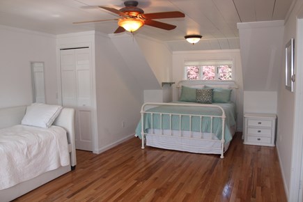 East Orleans Cape Cod vacation rental - Queen bedroom w/single bed and trundle, private bath & staircase.