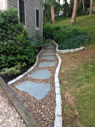 Eastham, Located on Schoolhouse Pond Cape Cod vacation rental - Bluestone walkway from the driveway to side yard.