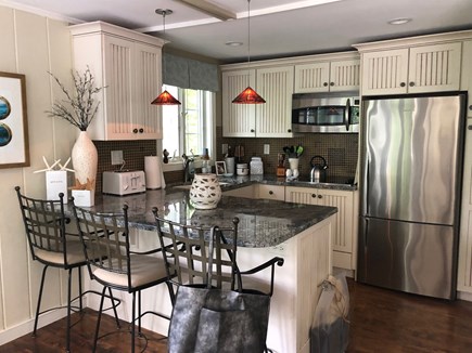 Eastham, Located on Schoolhouse Pond Cape Cod vacation rental - Fully renovated kitchen with breakfast bar.