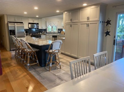 Falmouth Heights Cape Cod vacation rental - Kitchen & Dining Rm - 9 ft Island, gas stove, microwave, keurig;
