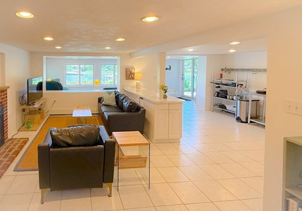 East Falmouth  Cape Cod vacation rental - The living room- a full size couch, TV, chair, & gas insert FP