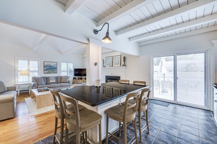 West Yarmouth Cape Cod vacation rental - Kitchen Island, Living Room, Slider to Back Deck