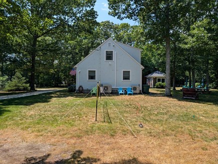 Eastham Cape Cod vacation rental - Side yard, volleyball, badminton, and horseshoe pit.