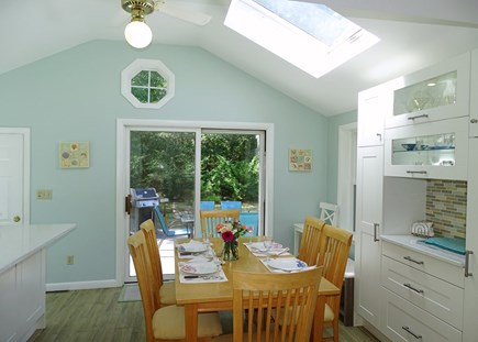 Harwich Port Cape Cod vacation rental - Bright dining area with skylight, slider to back deck 
