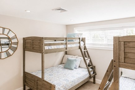 Dennis, Mayflower Beach Cape Cod vacation rental - Basement Bunkroom #2 with Twin over Double bunks(2) & TV<br/>