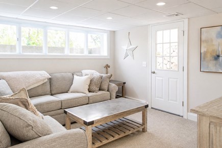 Dennis, Mayflower Beach Cape Cod vacation rental - Basement Den with TV & Pull out Couch<br/>
