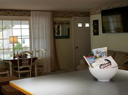 Dennisport Cape Cod vacation rental - Dining/living area includes Vermont Castings gas fireplace