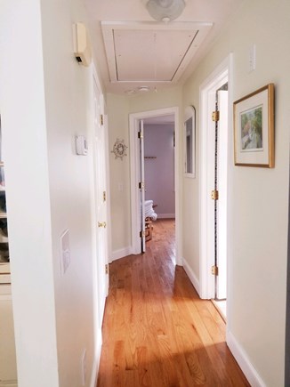Dennisport Cape Cod vacation rental - Hallway with gleaming floors and original CC Kennedy Artwork