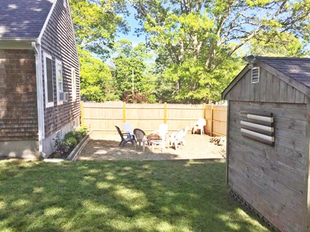 Dennis Cape Cod vacation rental - Back yard fire pit area