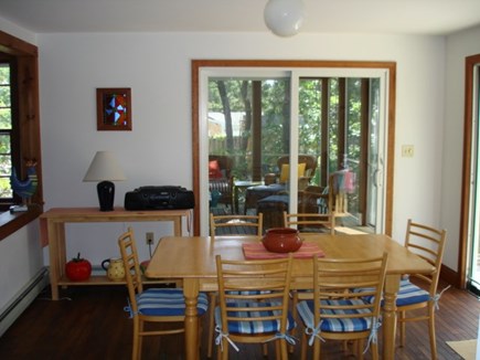 Wellfleet Cape Cod vacation rental - Dining room open to living room, screened porch & back yard views