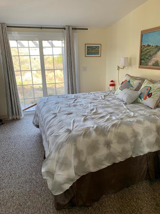 Wellfleet Cape Cod vacation rental - Master Bedroom w/ Attached Bath and AC Unit.  Slider to back deck