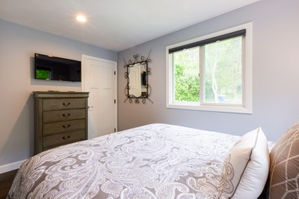 Barnstable Cape Cod vacation rental - Queen bedroom on main level with TV
