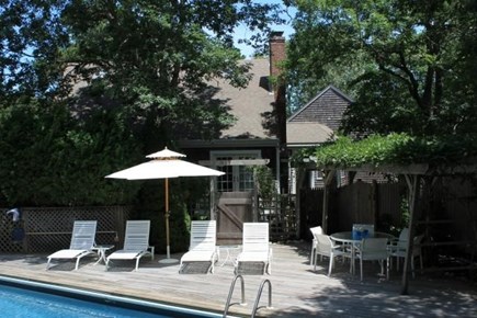 Truro Cape Cod vacation rental - Comfortable chaises, dining table, umbrella and chairs