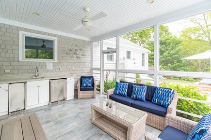 West Dennis Cape Cod vacation rental - Screened in porch with ice maker, sink and refrigerator