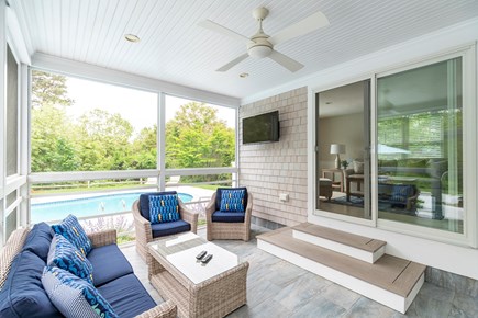 West Dennis Cape Cod vacation rental - Screened in porch with a wall mounted television