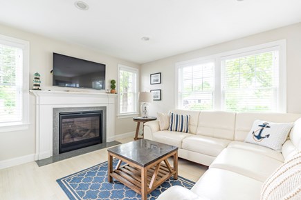 West Dennis Cape Cod vacation rental - Living Room with wall mounted television and gas fireplace