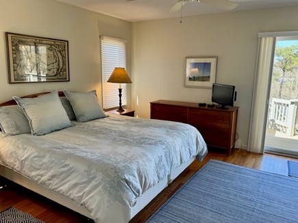 Orleans Cape Cod vacation rental - First floor Primary Bedroom with slider to deck