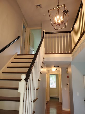 Dennis Village, North of 6A Cape Cod vacation rental - Open foyer and stairs