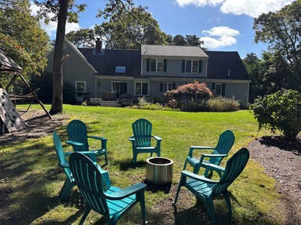 Dennis Village, North of 6A Cape Cod vacation rental - Firepit and swingset backyard. There's also a zip line.