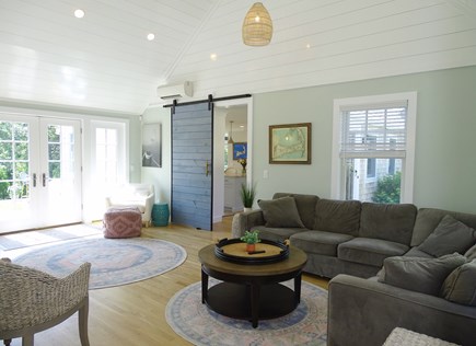 Chatham Cape Cod vacation rental - Den with sectional couch, opens to kitchen and back patio