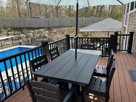 Eastham Cape Cod vacation rental - Upper deck with polywood outdoor table overlooking the pool