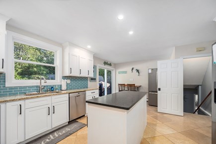 Eastham Cape Cod vacation rental - Main kitchen with slider out to the pool.